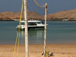 beach volleyball and boat